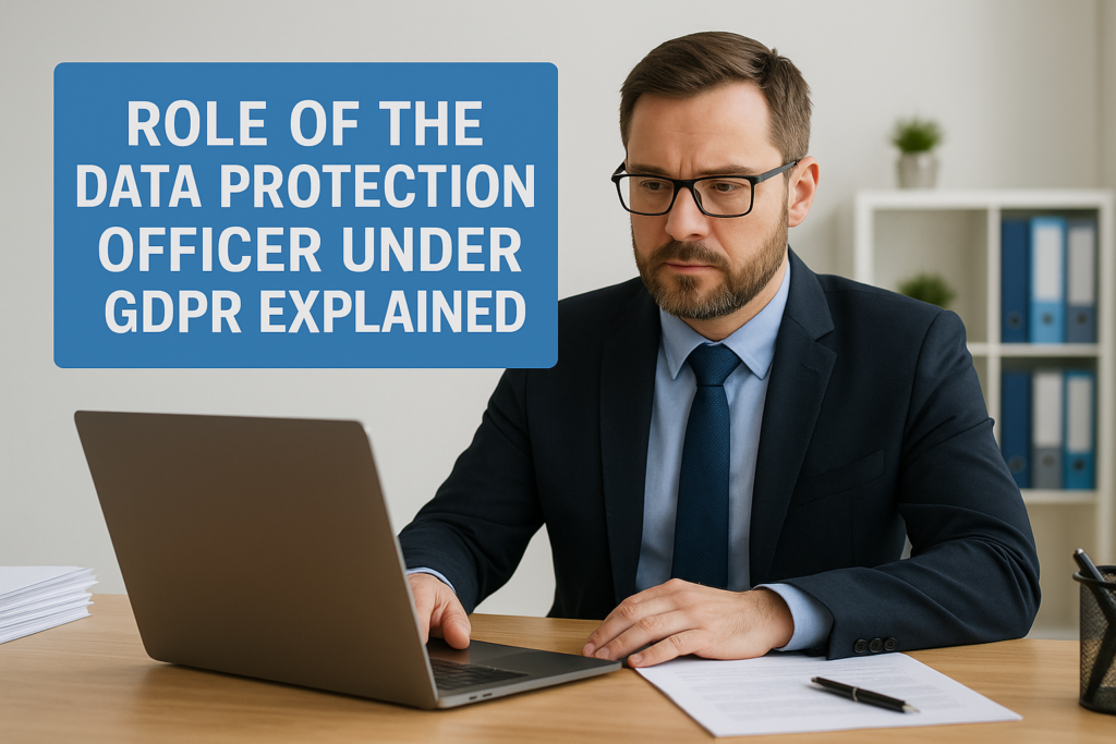 Professional in a dark suit and glasses works at a laptop; a large blue sign reads 'Role of the Data Protection Officer under GDPR explained' in the background.