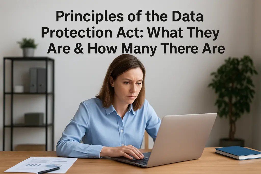 Woman at a desk using a laptop, with a large article title about the Data Protection Act in the background (informational image).